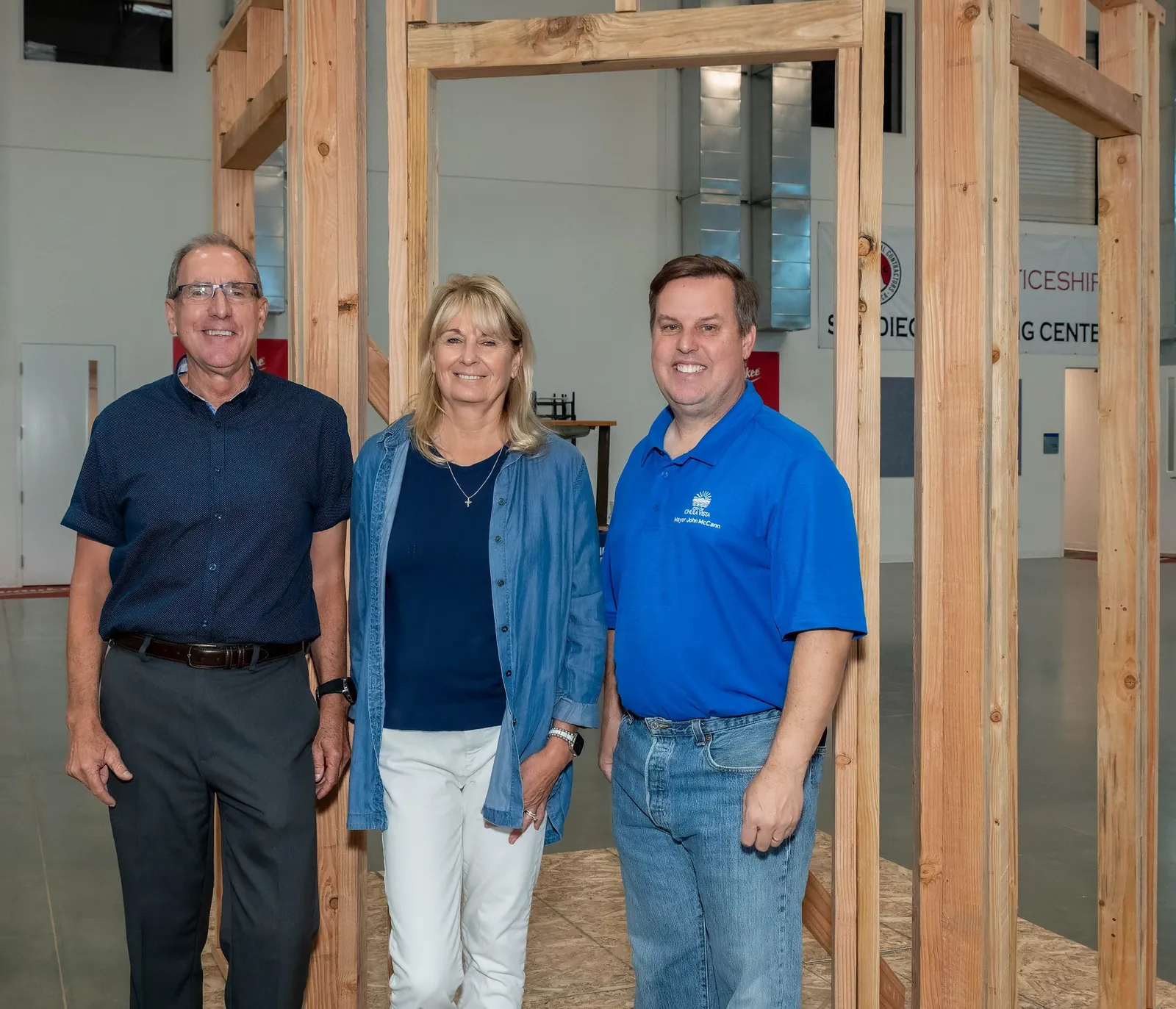 Partner representatives standing inside a regional apprenticeship training centre
